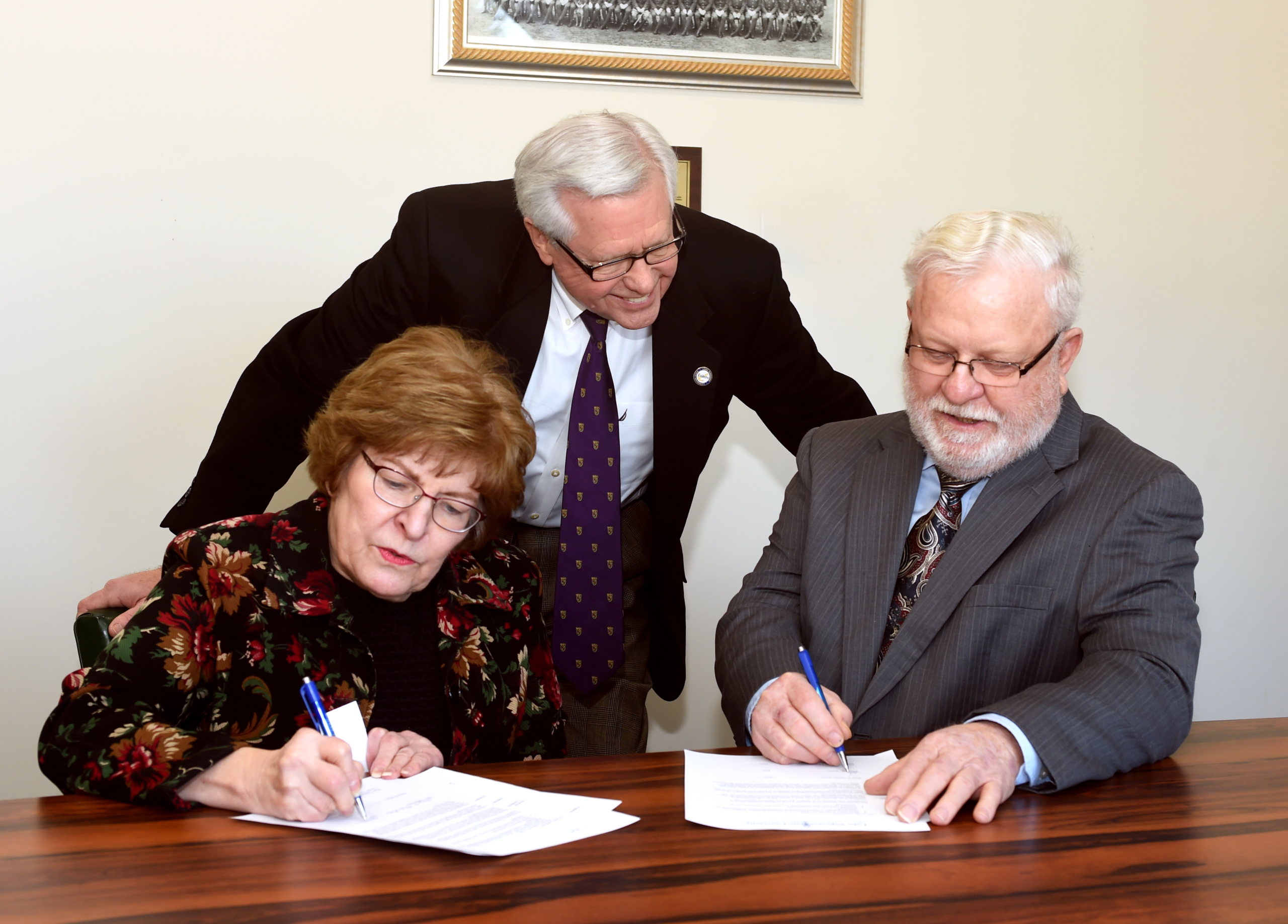 LSSU President Peter T. Mitchell and Sally and Robert Wiles sign to create a scholarship for science majors at Lake State