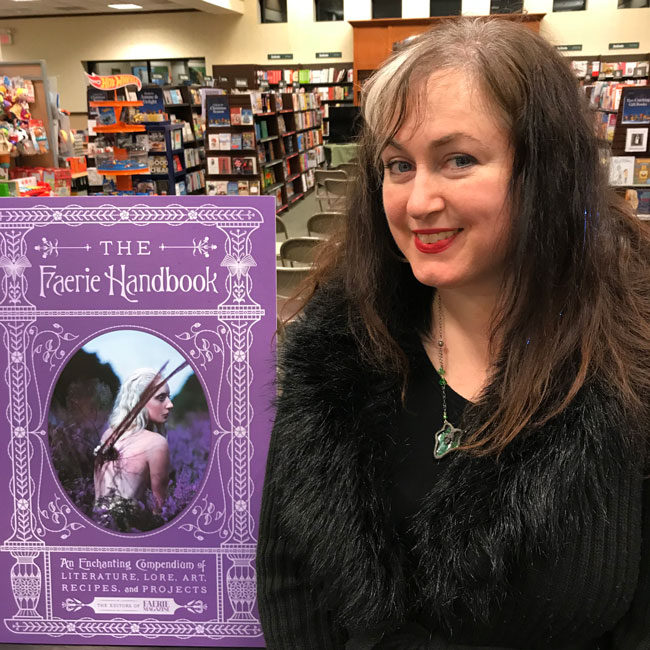 Author Carolyn Turgeon poses by The Faerie Handbook