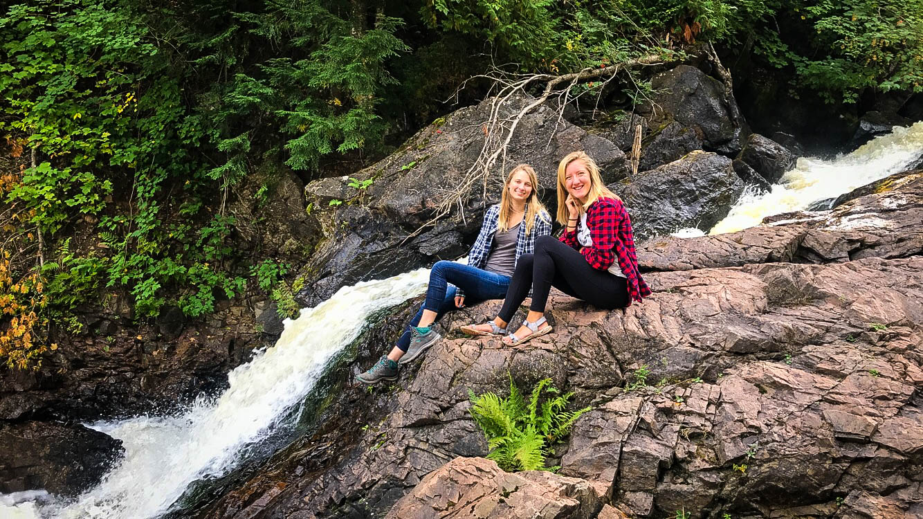 2 students outside at falls