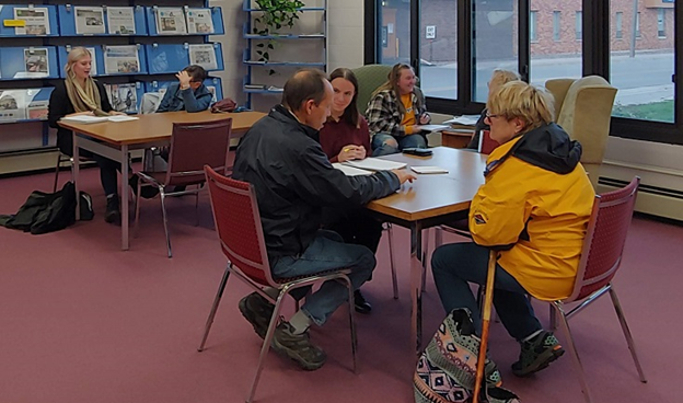 Students at the library work on a project