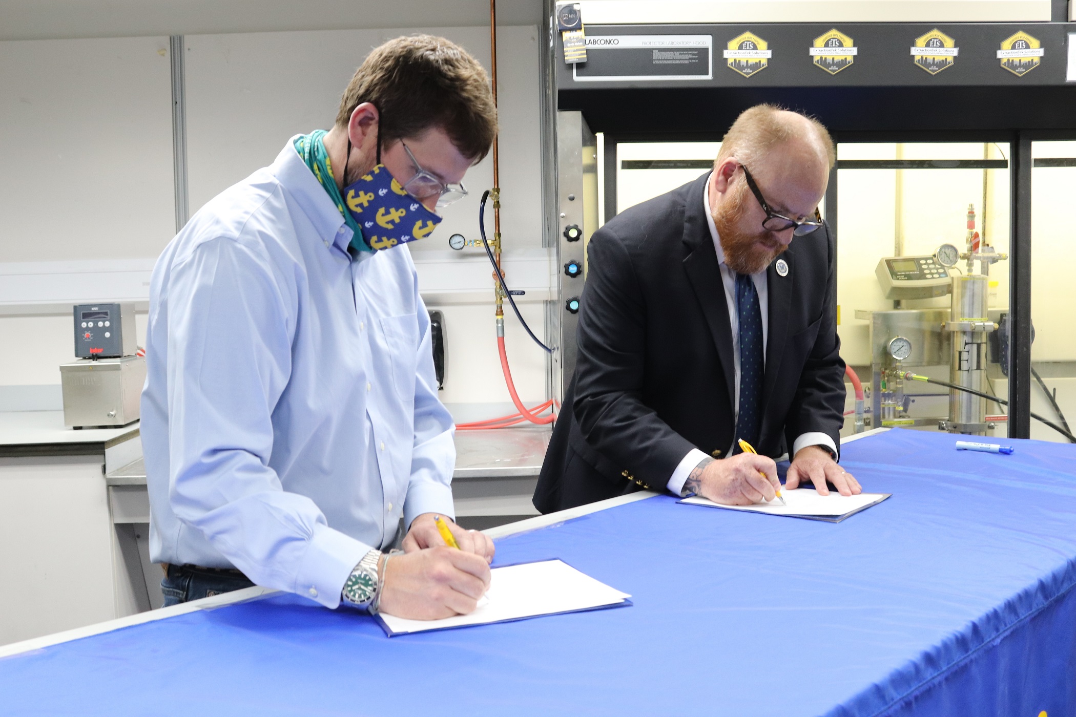 Officials sign the paperwork