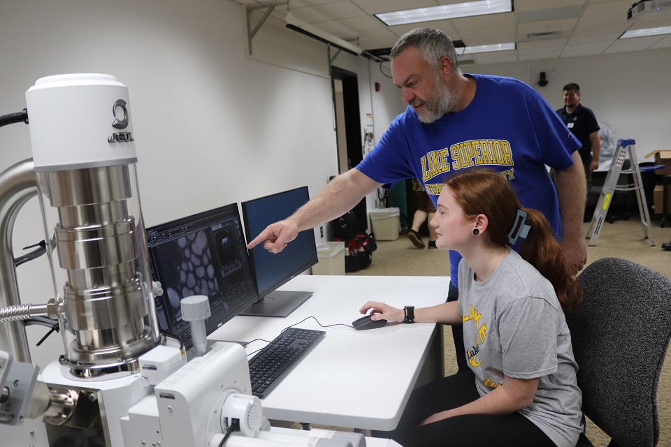 Dr. Derek David Wright, professor of environmental science, and senior biochemistry major Morgan Acker practice on LSSU’s new low vacuum scanning electron microscope.